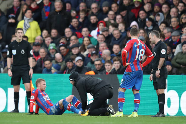 LONDON, ENGLAND - JANUARY 11: Max Meyer of Crystal Palace receives medical treatment after being fouled by Pierre-Emerick Aubameyang of Arsenal, who was later shown a red card following a VAR decision during the Premier League match between Crystal Palace and Arsenal FC at Selhurst Park on January 11, 2020 in London, United Kingdom. (Photo by Alex Pantling/Getty Images)