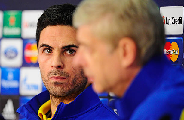 Arsene Wenger (R), manager of Arsenal FC and Mikel Arteta address the media during a press conference ahead of their UEFA Champions League round of sixteen second leg match against FC Bayern Muenchen at Allianz Arena on March 10, 2014 in Munich, Germany.