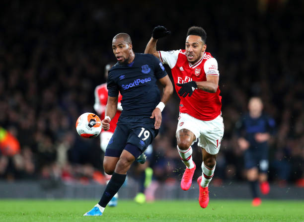 Djibril Sidibe of Everton battles for possession with Pierre-Emerick Aubameyang of Arsenal during the Premier League match between Arsenal FC and Everton FC at Emirates Stadium on February 23, 2020 in London, United Kingdom.
