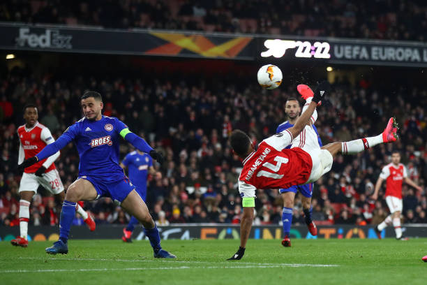 Pierre-Emerick Aubameyang of Arsenal FC scores his team's first goal in extra-time during the UEFA Europa League round of 32 second leg match between Arsenal FC and Olympiacos FC at Emirates Stadium on February 27, 2020 in London, United Kingdom.