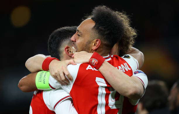 Pierre-Emerick Aubameyang of Arsenal FC celebrates scoring his sides first goal with teammates during the UEFA Europa League round of 32 second leg match between Arsenal FC and Olympiacos FC at Emirates Stadium on February 27, 2020 in London, United Kingdom.