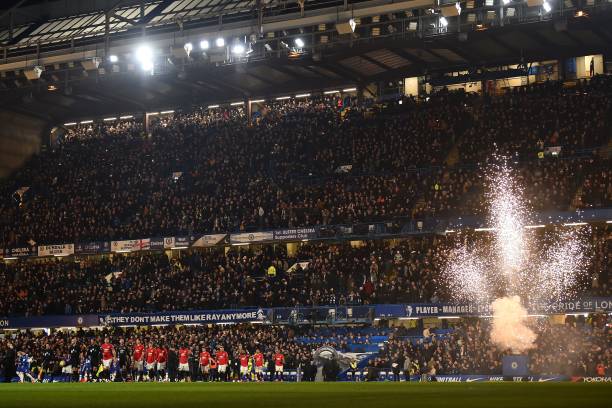 Players walk out for the English Premier League football match between Chelsea and Manchester United at Stamford Bridge in London on February 17, 2020. 