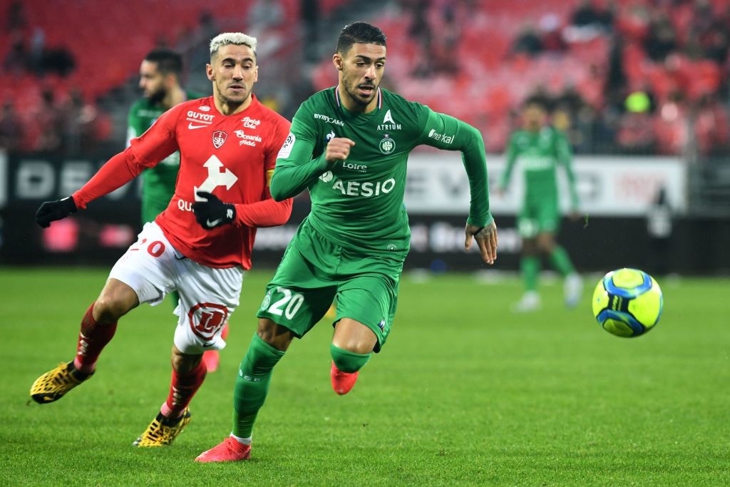 Brest's French defender Gaetan Belaud (L) vies with Saint-Etienne's Gabonese forward Denis Bouanga during the French L1 football match between Stade Brestois 29 and AS Saint-Etienne at the Francis Le Ble stadium in Brest, western France on February 16, 2020. (Photo by Fred TANNEAU / AFP)