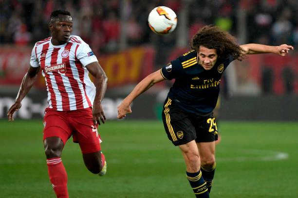Arsenal's French midfielder Matteo Guendouzi (R) vies with Olympiakos' Guinean midfielder Mohamed Mady Camara (L) during the UEFA Europa League round of 32 first leg football match between Olympiakos and Arsenal at the Karaiskakis Stadium in Piraeus, near Athens, on February 20, 2020.