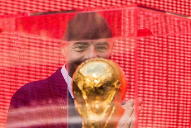 FIFA President Gianni Infantino looks at the FIFA World Cup Trophy during the trophy tour opening ceremony at Luzhniki stadium in Moscow on September 9, 2017.
