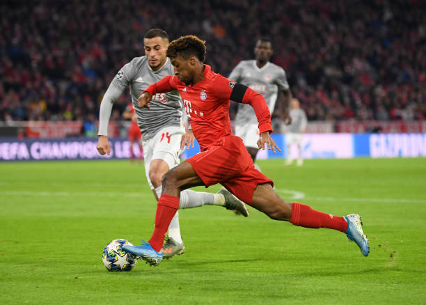 Kingsley Coman of FC Bayern Munich battles for possession with Omar Elabdellaoui of Olympiacos during the UEFA Champions League group B match between Bayern Muenchen and Olympiacos FC at Allianz Arena on November 06, 2019 in Munich, Germany.