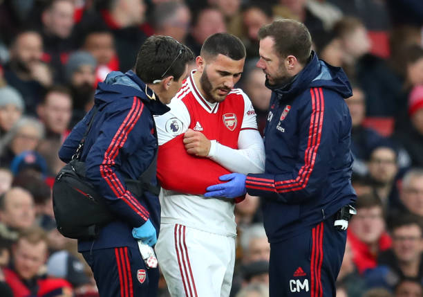 Sead Kolasinac of Arsenal leaves the pitch with an injury during the Premier League match between Arsenal FC and Everton FC at Emirates Stadium on February 23, 2020 in London, United Kingdom.