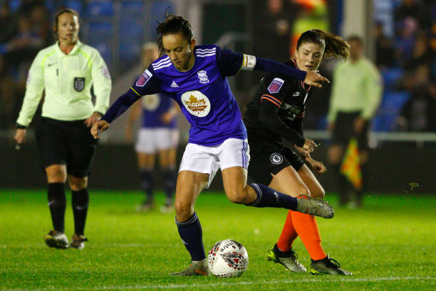 Lucy Staniforth of Birmingham City runs with the ball with pressure from Ramona Bachmann of Chelsea during the Barclays FA Women's Super League match between Birmingham City and Chelsea at Damson Park on November 24, 2019 in Solihull, United Kingdom. 