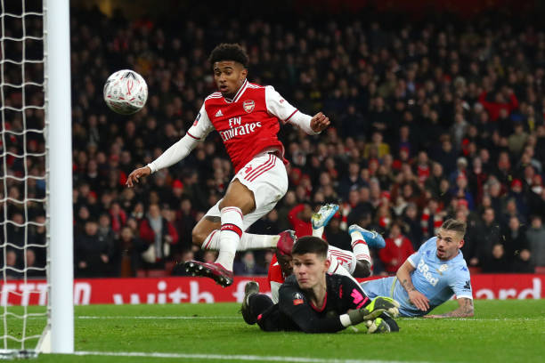 Reiss Nelson of Arsenal scores his side's first goal past Illan Meslier of Leeds United during the FA Cup Third Round match between Arsenal FC and Leeds United at the Emirates Stadium on January 06, 2020 in London, England. 