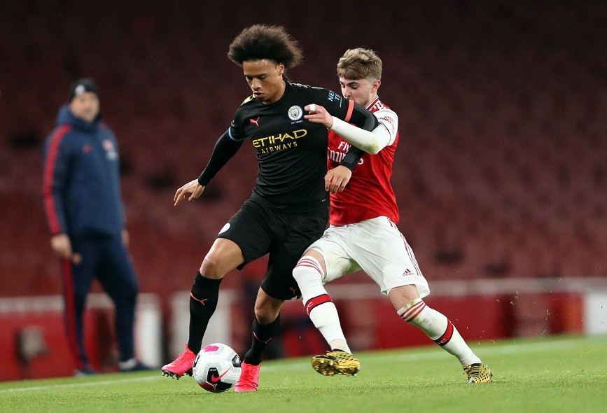 LONDON, ENGLAND - FEBRUARY 28: Leroy Sane of Manchester City battles for possession with Zak Swanson of Arsenal during the Premier League 2 match between Arsenal U23 and Manchester City U23 at Emirates Stadium on February 28, 2020 in London, England. (Photo by Linnea Rheborg/Getty Images)