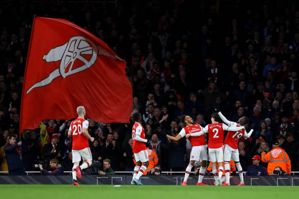 LONDON, ENGLAND - FEBRUARY 23: Pierre-Emerick Aubameyang of Arsenal celebrates with teammates Hector Bellerin and Nicolas Pepe after scoring his sides third goal during the Premier League match between Arsenal FC and Everton FC at Emirates Stadium on February 23, 2020 in London, United Kingdom. (Photo by Julian Finney/Getty Images)