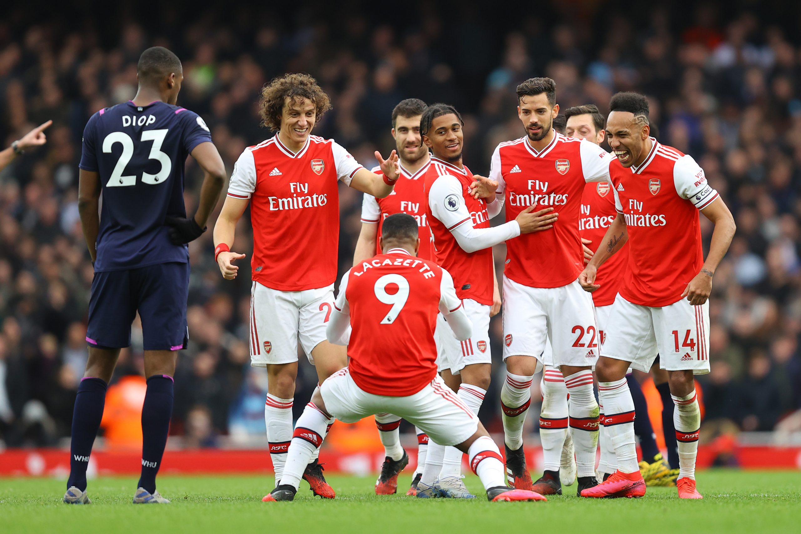 Alexandre Lacazette of Arsenal celebrates with teammates after scoring his team's first goal which was given by VAR during the Premier League match between Arsenal FC and West Ham United at Emirates Stadium on March 07, 2020 in London, United Kingdom.