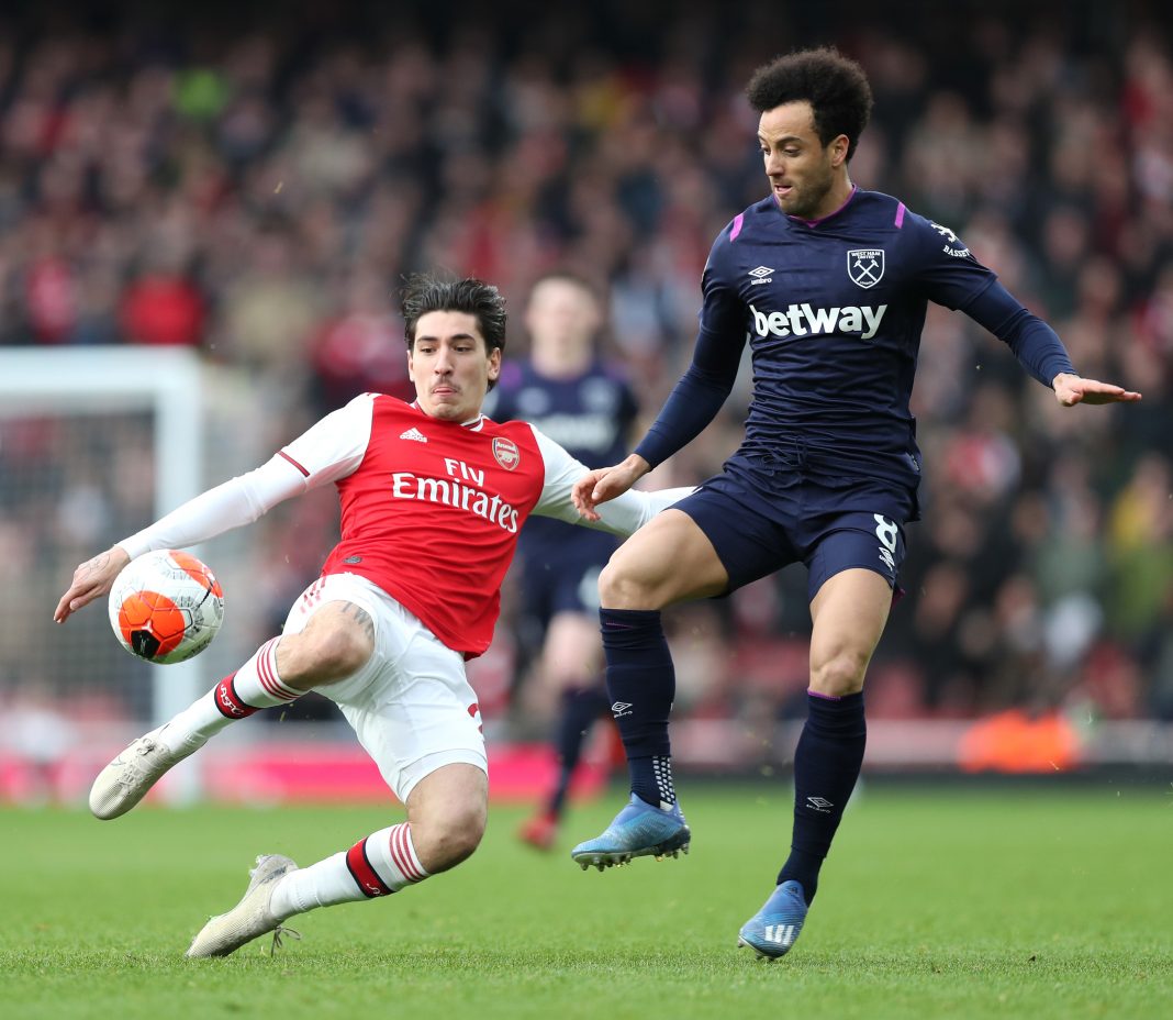 Felipe Anderson of West Ham United is challenged by Hector Bellerin of Arsenal during the Premier League match between Arsenal FC and West Ham United at Emirates Stadium on March 07, 2020 in London, United Kingdom.