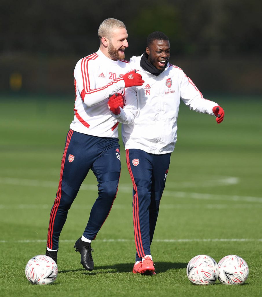 ST ALBANS, ENGLAND - MARCH 01: Shkodran Mustafi and Nicolas Pepe of Arsenal during a training session at London Colney on March 01, 2020 in St Albans, England. (Photo by Stuart MacFarlane/Arsenal FC via Getty Images)