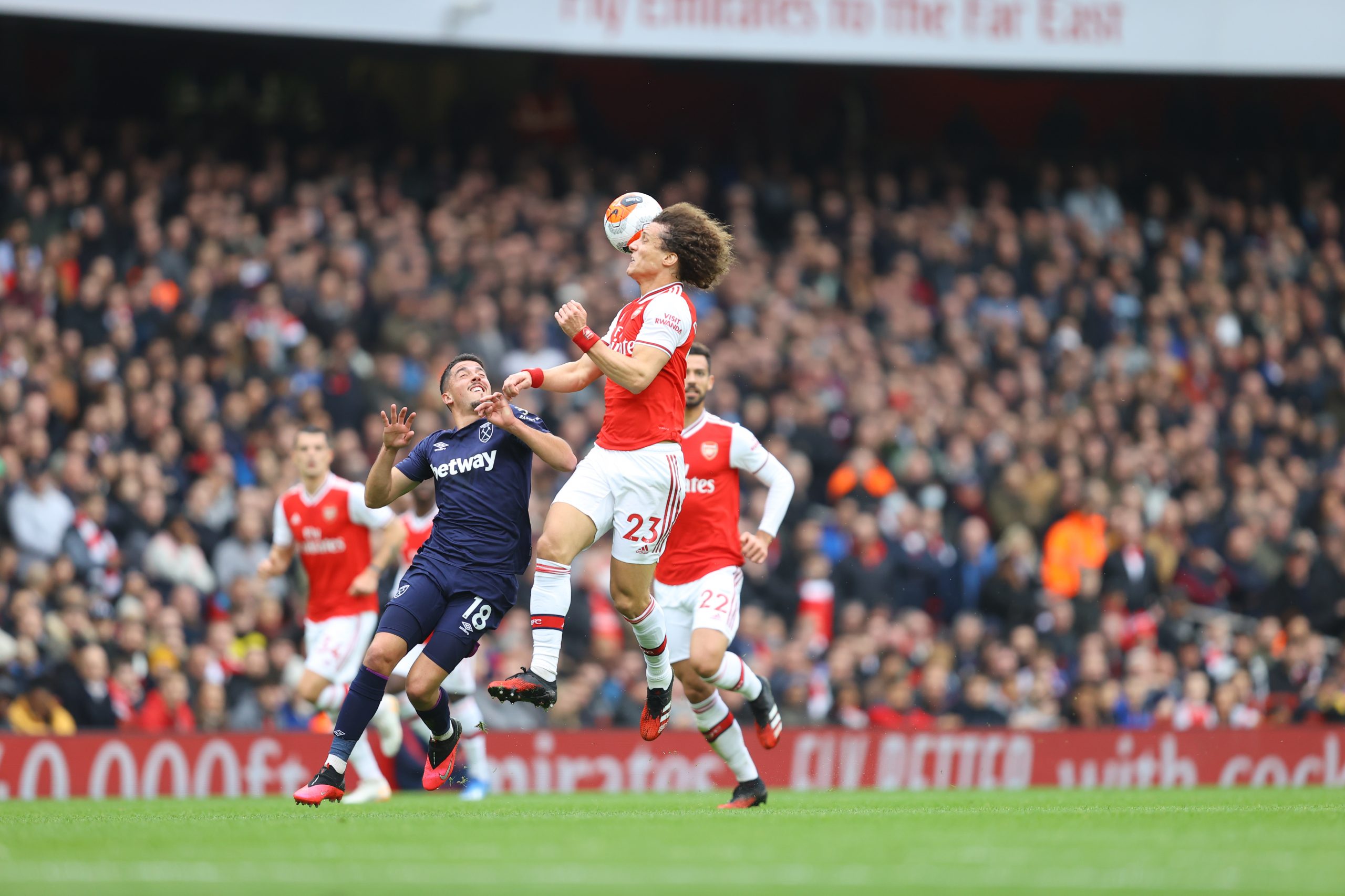 David Luiz of Arsenal wins a header over Pablo Fornals of West Ham United during the Premier League match between Arsenal FC and West Ham United at Emirates Stadium on March 07, 2020 in London, United Kingdom.