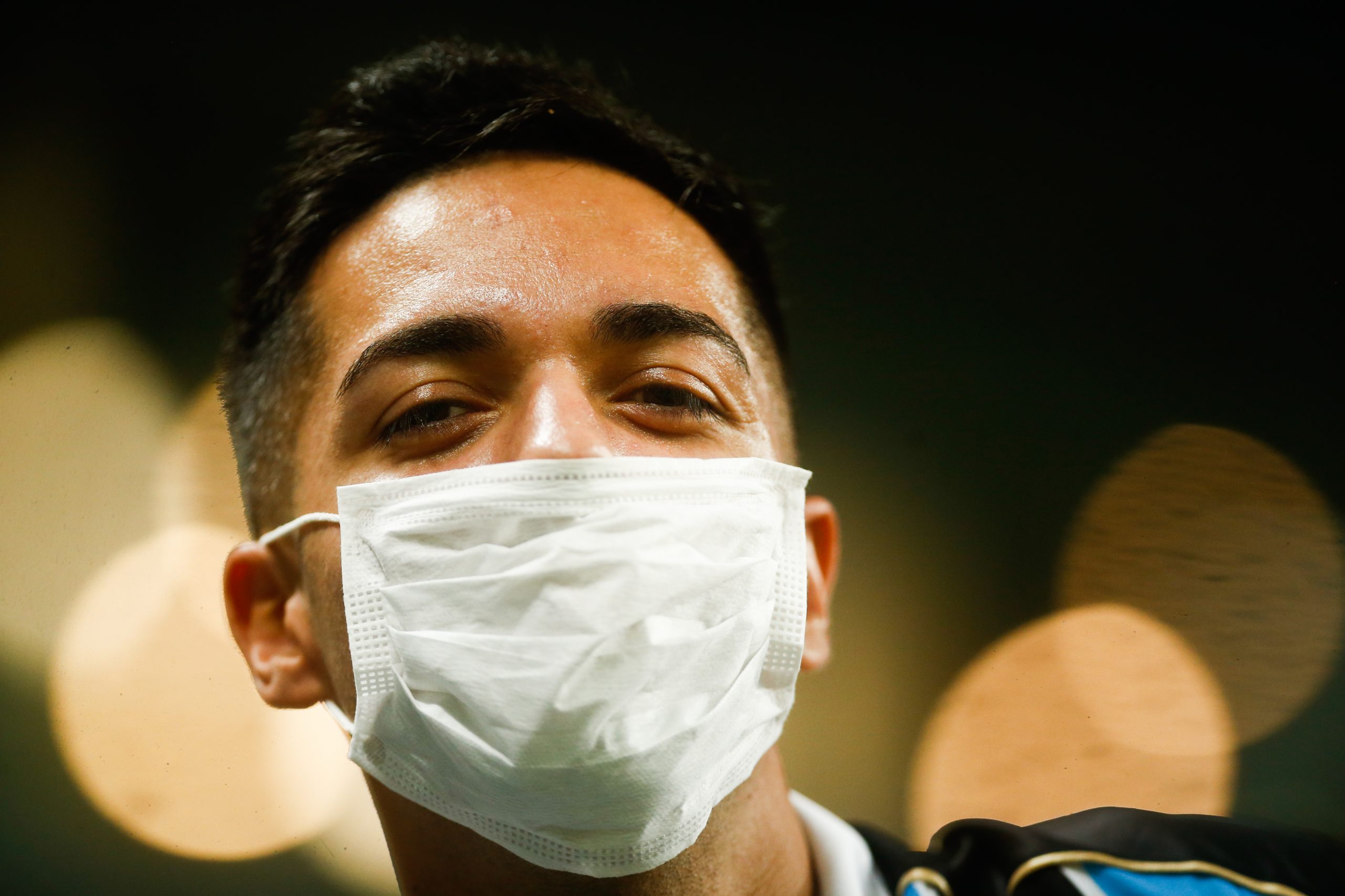 A fan wears a protective mask to take precautions against the spread of the Coronavirus (COVID-19) before the match against Internacional for the Copa CONMEBOL Libertadores 2020 at Arena do Gremio on March 12, 2020 in Porto Alegre, Brazil.