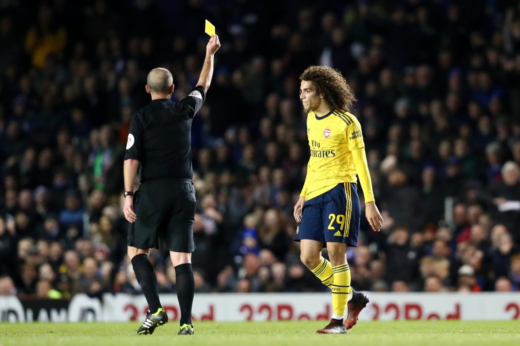 Matteo Guendouzi of Arsenal is shown a yellow card by referee Mike Dean during the FA Cup Fifth Round match between Portsmouth FC and Arsenal FC at Fratton Park on March 02, 2020 in Portsmouth, England.