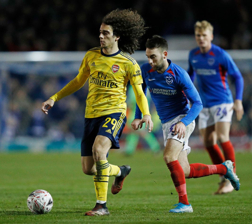 Arsenal's French midfielder Matteo Guendouzi (L) runs away from Portsmouth's English midfielder Ben Close (R) during the English FA Cup fifth round football match between Portsmouth and Arsenal at Fratton Park stadium in Portsmouth, southern England, on March 2, 2020.