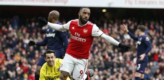 Arsenal's French striker Alexandre Lacazette celebrates after scoring the opening goal of the English Premier League football match between Arsenal and West Ham at the Emirates Stadium in London on March 7, 2020.