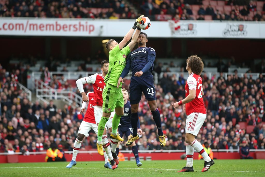 Bernd Leno of Arsenal saves a header from Sebastien Haller of West Ham United during the Premier League match between Arsenal FC and West Ham United at Emirates Stadium on March 07, 2020 in London, United Kingdom.
