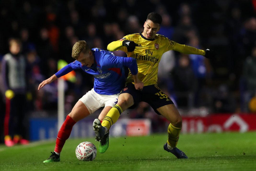 Gabriel Martinelli of Arsenal battles for possession with Ross McCrorie of Portsmouth FC during the FA Cup Fifth Round match between Portsmouth FC and Arsenal FC at Fratton Park on March 02, 2020 in Portsmouth, England.