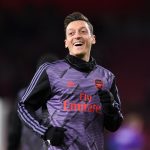 Arsenal's German midfielder Mesut Ozil warms up for the English Premier League football match between Arsenal and Manchester City at the Emirates Stadium in London on December 15, 2019.