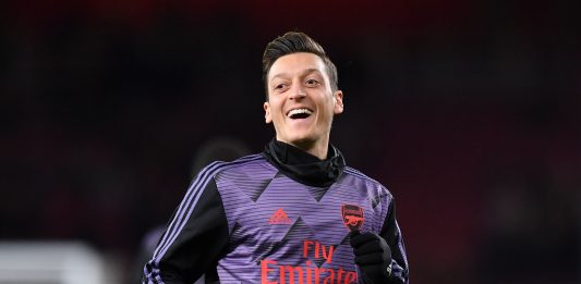 Arsenal's German midfielder Mesut Ozil warms up for the English Premier League football match between Arsenal and Manchester City at the Emirates Stadium in London on December 15, 2019.