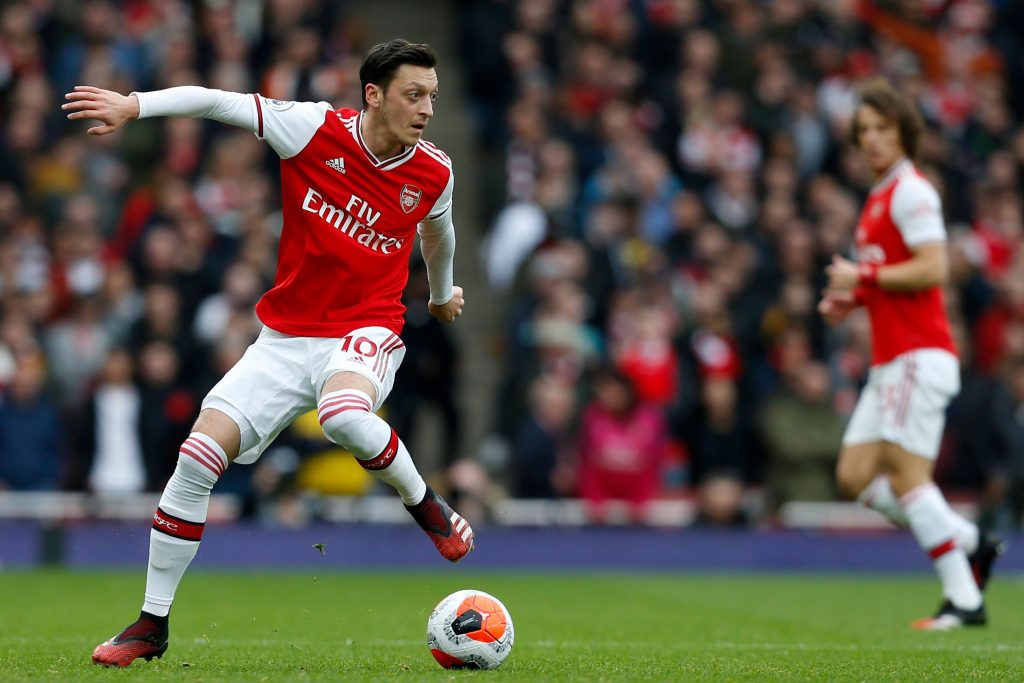 Arsenal's German midfielder Mesut Ozil controls the ball during the English Premier League football match between Arsenal and West Ham at the Emirates Stadium in London on March 7, 2020.