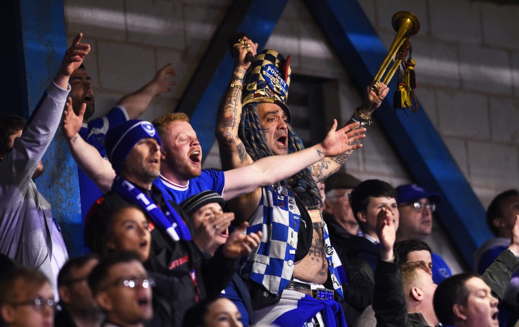 Portsmouth fans sing during the Checkatrade Trophy match between Bury and Portsmouth at Gigg Lane on February 26, 2019 in Bury, England. 