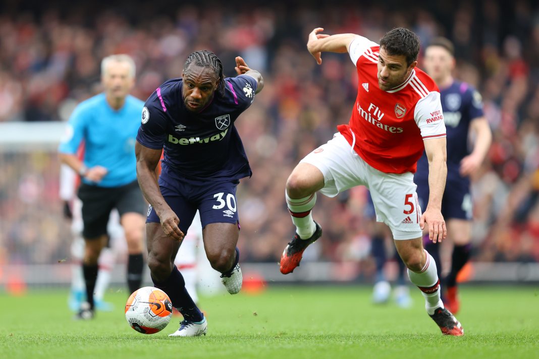 Michail Antonio of West Ham United battles for possession with Sokratis Papastathopoulos of Arsenal during the Premier League match between Arsenal FC and West Ham United at Emirates Stadium on March 07, 2020 in London, United Kingdom.