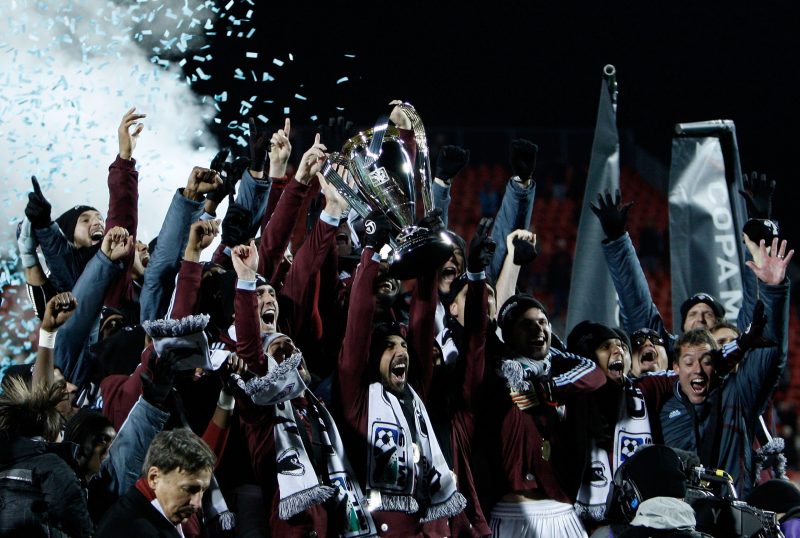 TORONTO, ON - NOVEMBER 21:  Captain Pablo Mastroeni #25 of the Colorado Rapids holds the Philip F. Anschutz Trophy and celebrates with teammates after their 2-1 overtime victory against FC Dallas during the 2010 MLS Cup match at BMO Field on November 21, 2010 in Toronto, Canada.  (Photo by Abelimages/Getty Images)