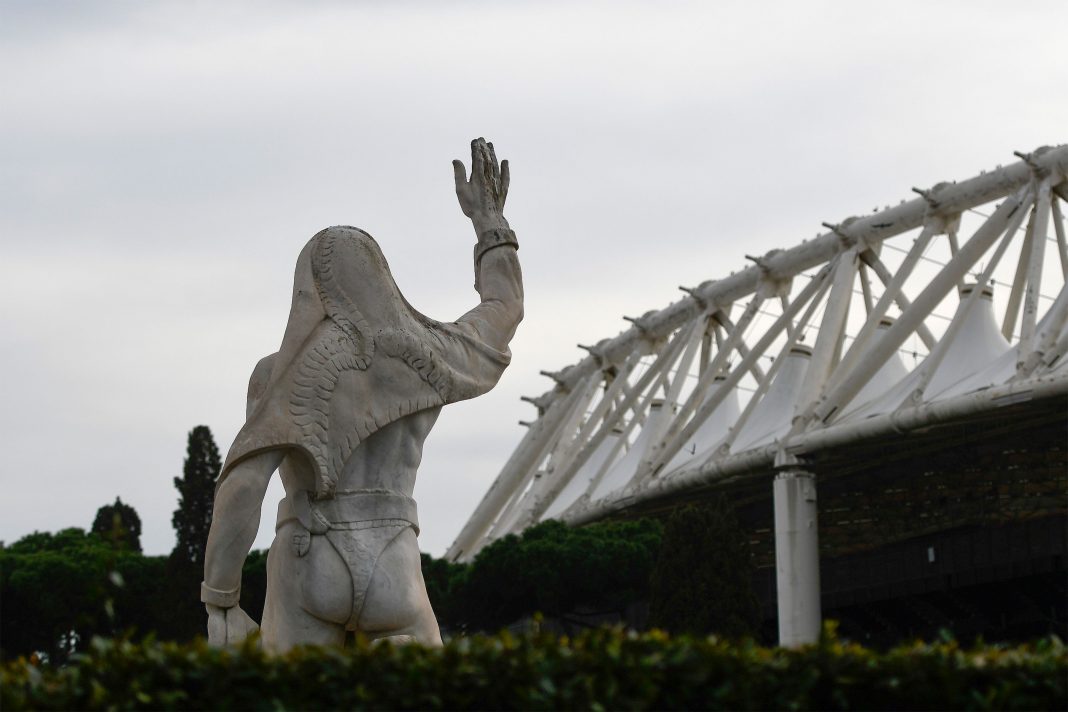 A photo taken on March 17, 2020 shows the Olympic stadium in Rome, with a statue from the Marbles stadium (Stadio dei Marmi) in foreground. - The European EURO 2020 football championship, due to be played in June and July this year with its opening game and three others at the Olympic stadium in Rome, has been postponed until 2021 because of the coronavirus pandemic, European football's governing body UEFA said on March 17. (Photo by Filippo MONTEFORTE / AFP) (Photo by FILIPPO MONTEFORTE/AFP via Getty Images)