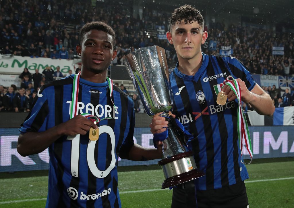BERGAMO, ITALY - OCTOBER 28: Roberto Piccoli (R) and Amad Traore of Atalanta Bc celebrate with the trophy the victory of the Primavera Tim Supercup at the end of the Primavera TIM Supercup match between Atalanta BC U19 and ACF Fiorentina U19 at Gewiss Stadium on October 28, 2019 in Bergamo, Italy. (Photo by Emilio Andreoli/Getty Images for Lega Serie A)