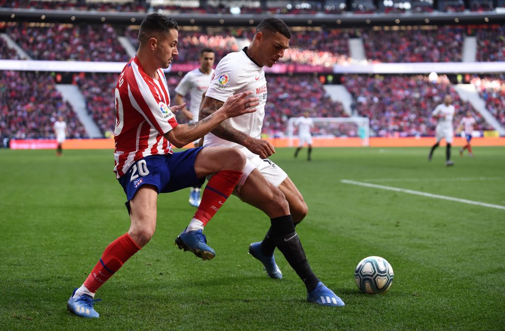 MADRID, SPAIN - MARCH 07: Vitolo of Atletico Madrid battles for possession with Diego Carlos of Sevilla FC during the Liga match between Club Atletico de Madrid and Sevilla FC at Wanda Metropolitano on March 07, 2020 in Madrid, Spain. (Photo by Denis Doyle/Getty Images)