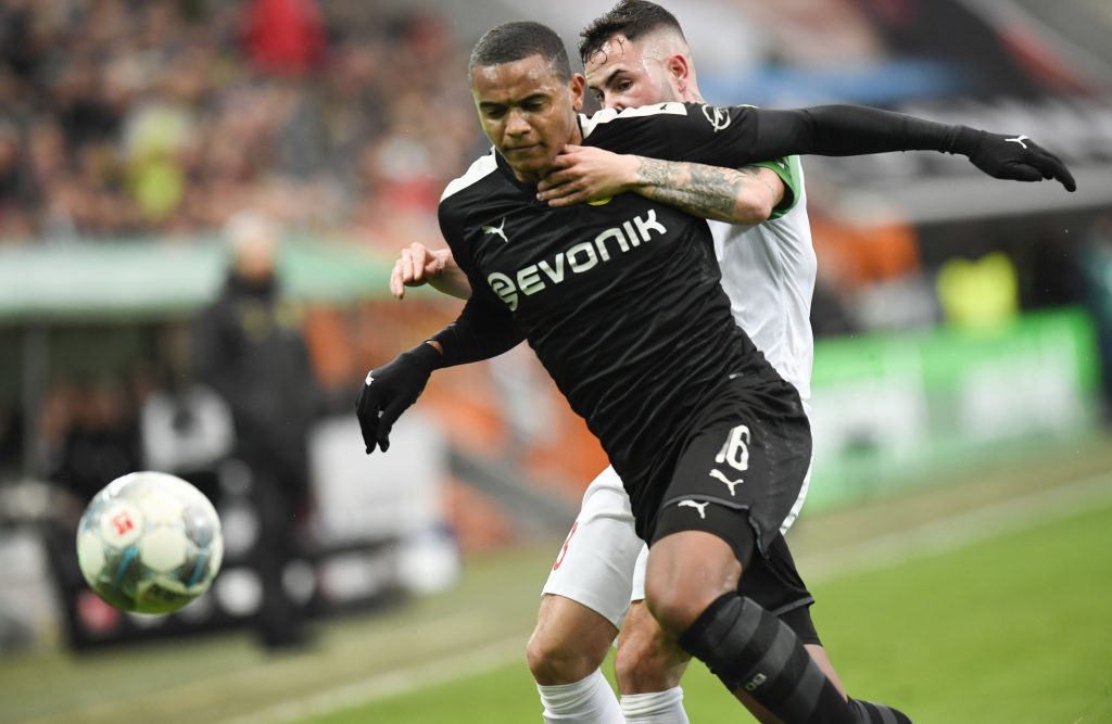 Augsburg's German midfielder Marco Richter (R) and Dortmund's Swiss defender Manuel Akanji vie for the ball during the German first division Bundesliga football match Augsburg v Borussia Dortmund in Augsburg, on January 18, 2020. (Photo by THOMAS KIENZLE / AFP) / DFL REGULATIONS PROHIBIT ANY USE OF PHOTOGRAPHS AS IMAGE SEQUENCES AND/OR QUASI-VIDEO (Photo by THOMAS KIENZLE/AFP via Getty Images)