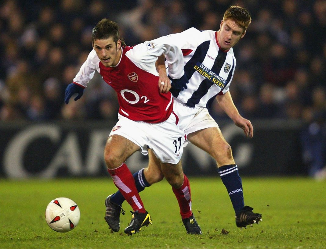 WEST BROMWICH, ENGLAND - DECEMBER 16: David Bentley of Arsenal avoids James O'Connor of West Bromwich Albion during the Carling Cup Quarter Final match between West Bromwich Albion and Arsenal at The Hawthorns on December 16, 2003 in West Bromwich, England. (Photo by Ross Kinnaird/Getty Images)