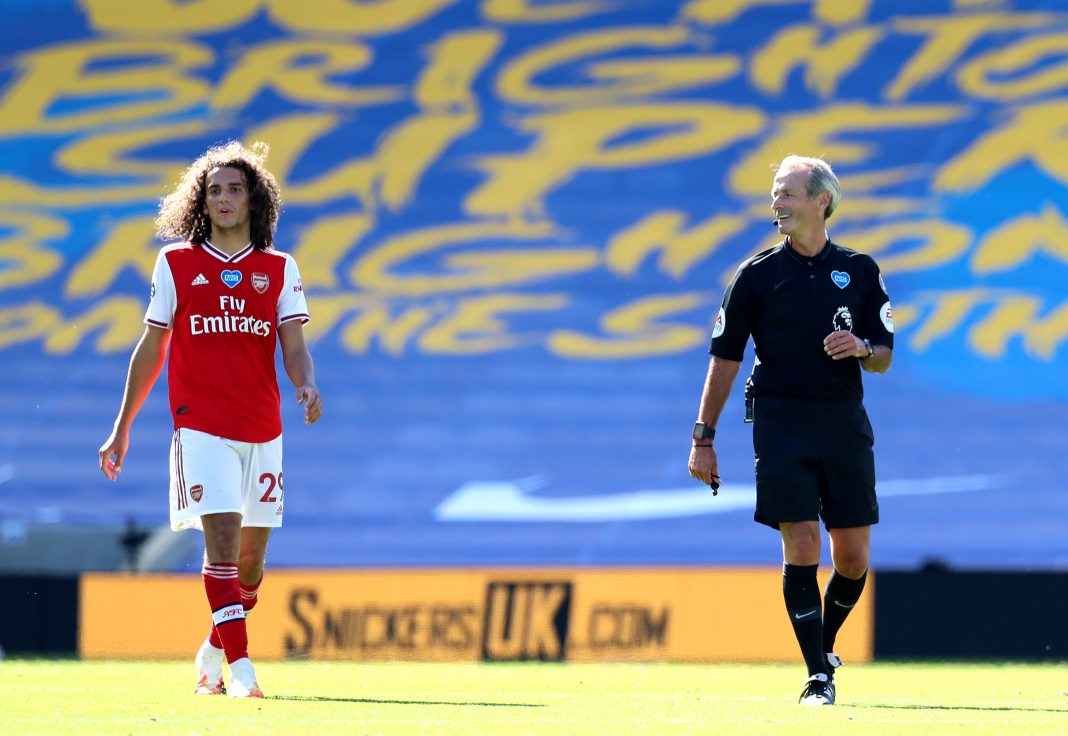 BRIGHTON, ENGLAND - JUNE 20: Referee Martin Atkinson speaks to Matteo Guendouzi of Arsenal during the Premier League match between Brighton & Hove Albion and Arsenal FC at American Express Community Stadium on June 20, 2020 in Brighton, England. Football Stadiums around Europe remain empty due to the Coronavirus Pandemic as Government social distancing laws prohibit fans inside venues resulting in all fixtures being played behind closed doors. (Photo by Gareth Fuller/Pool via Getty Images)