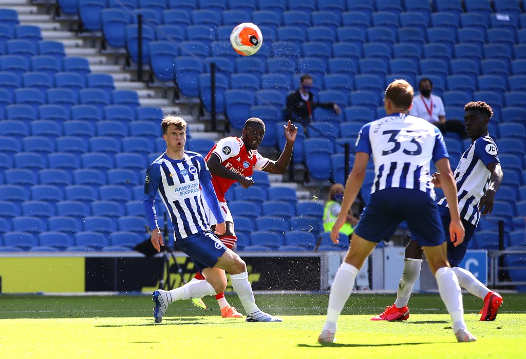 BRIGHTON, ENGLAND - JUNE 20: Nicolas Pepe of Arsenal scores his team's first goal past Matthew Ryan of Brighton and Hove Albion (not pictured)during the Premier League match between Brighton & Hove Albion and Arsenal FC at American Express Community Stadium on June 20, 2020 in Brighton, England. Football Stadiums around Europe remain empty due to the Coronavirus Pandemic as Government social distancing laws prohibit fans inside venues resulting in all fixtures being played behind closed doors. (Photo by Richard Heathcote/Getty Images)
