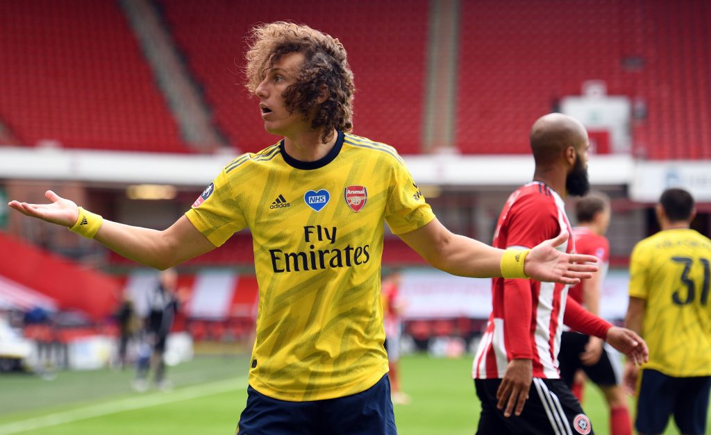 Arsenal's Brazilian defender David Luiz gestures during the English FA Cup quarter-final football match between Sheffield United and Arsenal at Bramall Lane in Sheffield, northern England on June 28, 2020. (Photo by Oli SCARFF / POOL / AFP) / RESTRICTED TO EDITORIAL USE. No use with unauthorized audio, video, data, fixture lists, club/league logos or 'live' services. Online in-match use limited to 120 images. An additional 40 images may be used in extra time. No video emulation. Social media in-match use limited to 120 images. An additional 40 images may be used in extra time. No use in betting publications, games or single club/league/player publications. / (Photo by OLI SCARFF/POOL/AFP via Getty Images)