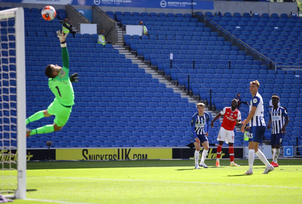 Arsenal's French-born Ivorian midfielder Nicolas Pepe (3R) scores during the English Premier League football match between Brighton and Hove Albion and Arsenal at the American Express Community Stadium in Brighton, southern England on June 20, 2020. (Photo by Richard Heathcote / POOL / AFP) / RESTRICTED TO EDITORIAL USE. No use with unauthorized audio, video, data, fixture lists, club/league logos or 'live' services. Online in-match use limited to 120 images. An additional 40 images may be used in extra time. No video emulation. Social media in-match use limited to 120 images. An additional 40 images may be used in extra time. No use in betting publications, games or single club/league/player publications. / (Photo by RICHARD HEATHCOTE/POOL/AFP via Getty Images)