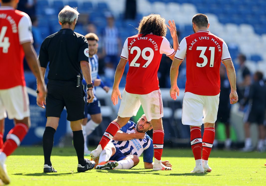 Arsenal's French midfielder Matteo Guendouzi (2R) challenges winning goalscorer Brighton's French striker Neal Maupay after the English Premier League football match between Brighton and Hove Albion and Arsenal at the American Express Community Stadium in Brighton, southern England on June 20, 2020. - Brighton won 2-1. (Photo by Richard Heathcote / POOL / AFP)