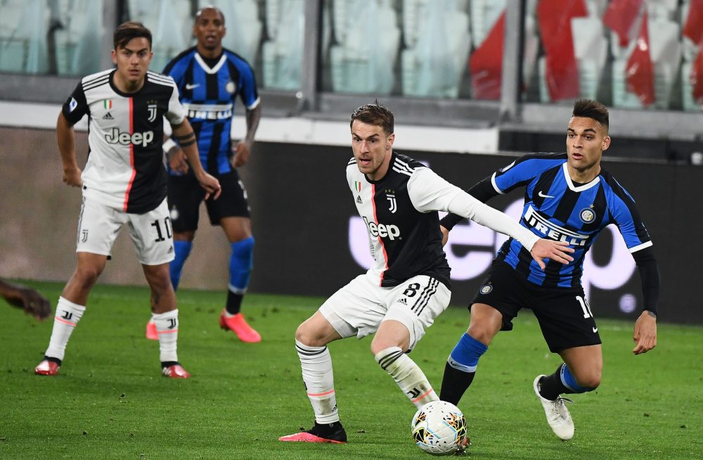 Juventus' Welsh midfielder Aaron Ramsey (2ndR) vies with Inter Milan's Argentinian forward Lautaro Martinez during the Italian Serie A football match Juventus vs Inter Milan, at the Juventus stadium in Turin on March 8, 2020. - The match is played behind closed doors due to the novel coronavirus outbreak. (Photo by Vincenzo PINTO / AFP) (Photo by VINCENZO PINTO/AFP via Getty Images)