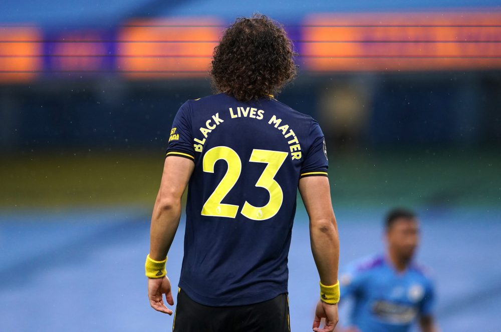 MANCHESTER, ENGLAND - JUNE 17: Black Lives Matter slogan is seen on the back of for David Luiz of Arsenal as he looks on during the Premier League match between Manchester City and Arsenal FC at Etihad Stadium on June 17, 2020 in Manchester, United Kingdom. (Photo by Dave Thompson/ Pool via Getty Images)