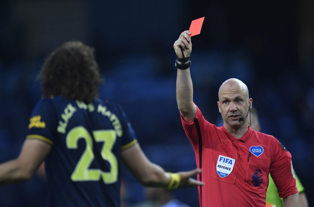 MANCHESTER, ENGLAND - JUNE 17: David Luiz of Arsenal receives a red card from match referee Anthony Taylor during the Premier League match between Manchester City and Arsenal FC at Etihad Stadium on June 17, 2020 in Manchester, United Kingdom. (Photo by Peter Powell/Pool via Getty Images)