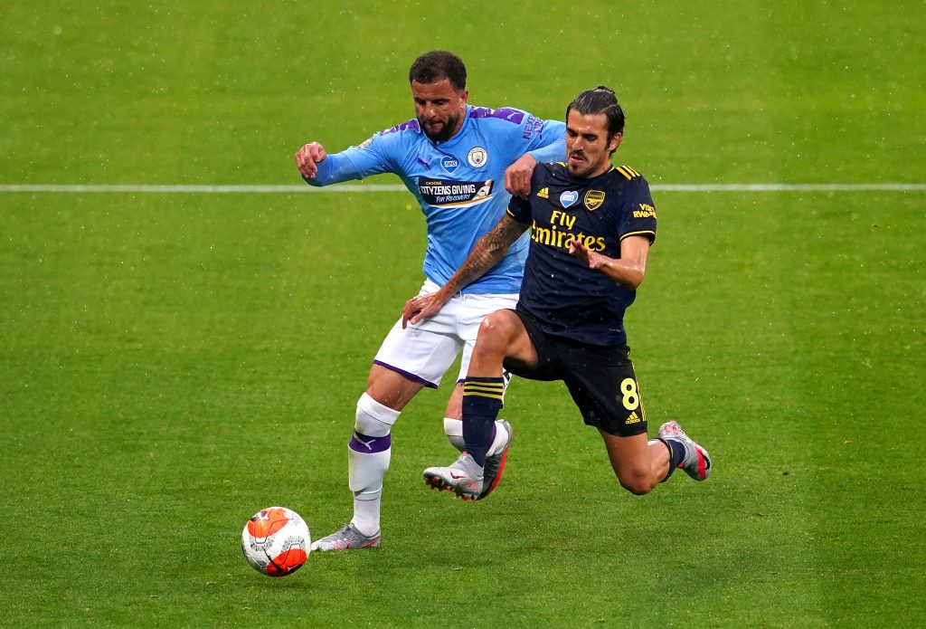 MANCHESTER, ENGLAND - JUNE 17: Kyle Walker of Manchester City battles for possession with Dani Ceballos of Arsenal during the Premier League match between Manchester City and Arsenal FC at Etihad Stadium on June 17, 2020 in Manchester, United Kingdom. (Photo by Dave Thompson/ Pool via Getty Images)