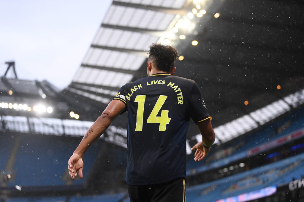 MANCHESTER, ENGLAND - JUNE 17: Pierre-Emerick Aubameyang of Arsenal displays the message 'Black Lives Matter" on his shirt during the Premier League match between Manchester City and Arsenal FC at Etihad Stadium on June 17, 2020 in Manchester, United Kingdom. Football Stadiums around Europe remain empty due to the Coronavirus Pandemic as Government social distancing laws prohibit fans inside venues resulting in all fixtures being played behind closed doors. (Photo by Laurence Griffiths/Getty Images)