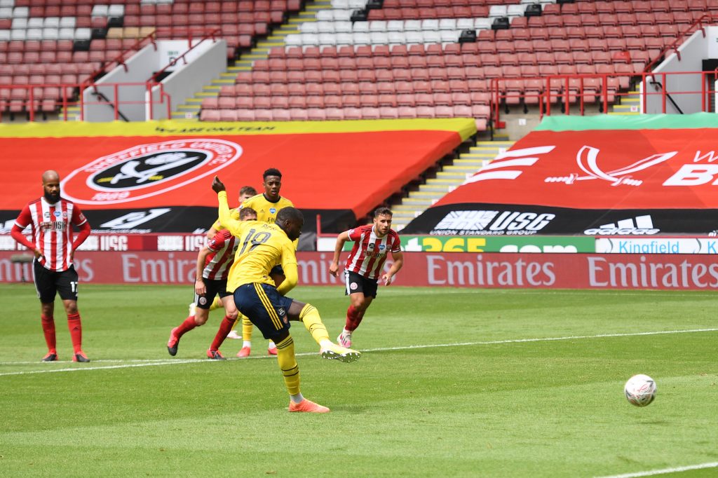 SHEFFIELD, ENGLAND - JUNE 28: Nicolas Pepe of Arsenal scores his sides first goal from the penalty spot during the FA Cup Fifth Quarter Final match between Sheffield United and Arsenal FC at Bramall Lane on June 28, 2020 in Sheffield, England. (Photo by Oli Scarff/Pool via Getty Images)