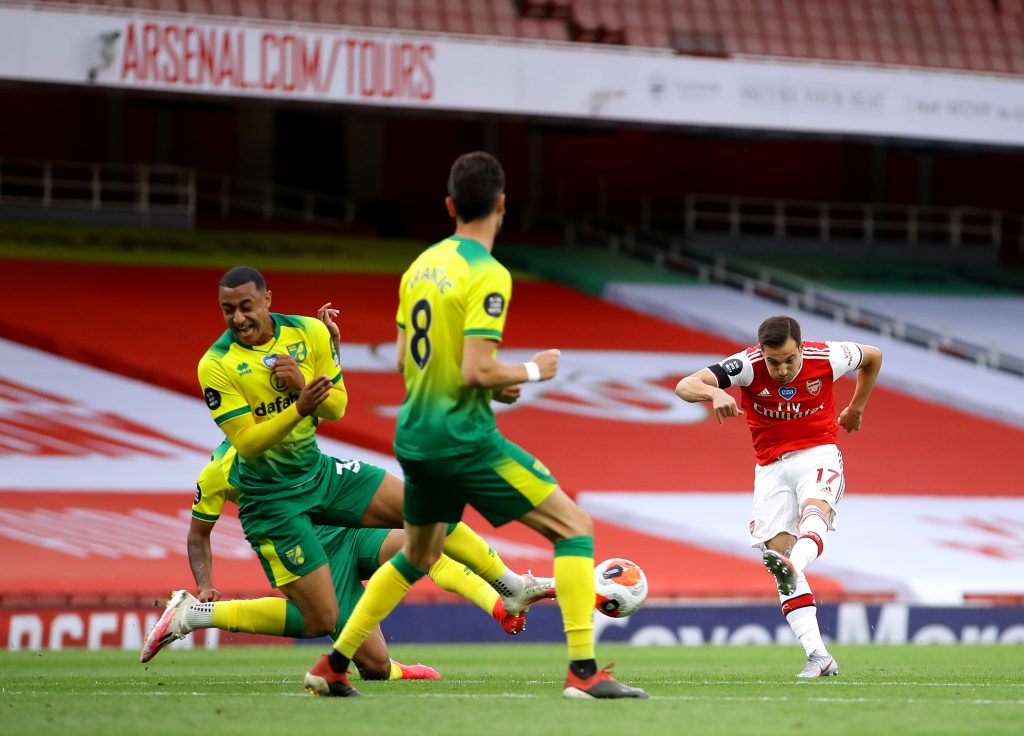 LONDON, ENGLAND - JULY 01: Cedric Soares of Arsenal shoots and scores his team's fourth goal during the Premier League match between Arsenal FC and Norwich City at Emirates Stadium on July 01, 2020 in London, England. Football Stadiums around Europe remain empty due to the Coronavirus Pandemic as Government social distancing laws prohibit fans inside venues resulting in all fixtures being played behind closed doors. (Photo by Richard Heathcote/Getty Images)