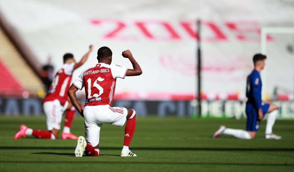 LONDON, ENGLAND - AUGUST 01: Ainsley Maitland-Niles of Arsenal takes a knee in support of the Black Lives Matter movement during the Heads Up FA Cup Final match between Arsenal and Chelsea at Wembley Stadium on August 01, 2020 in London, England. Football Stadiums around Europe remain empty due to the Coronavirus Pandemic as Government social distancing laws prohibit fans inside venues resulting in all fixtures being played behind closed doors. (Photo by Adam Davy/Pool via Getty Images)
