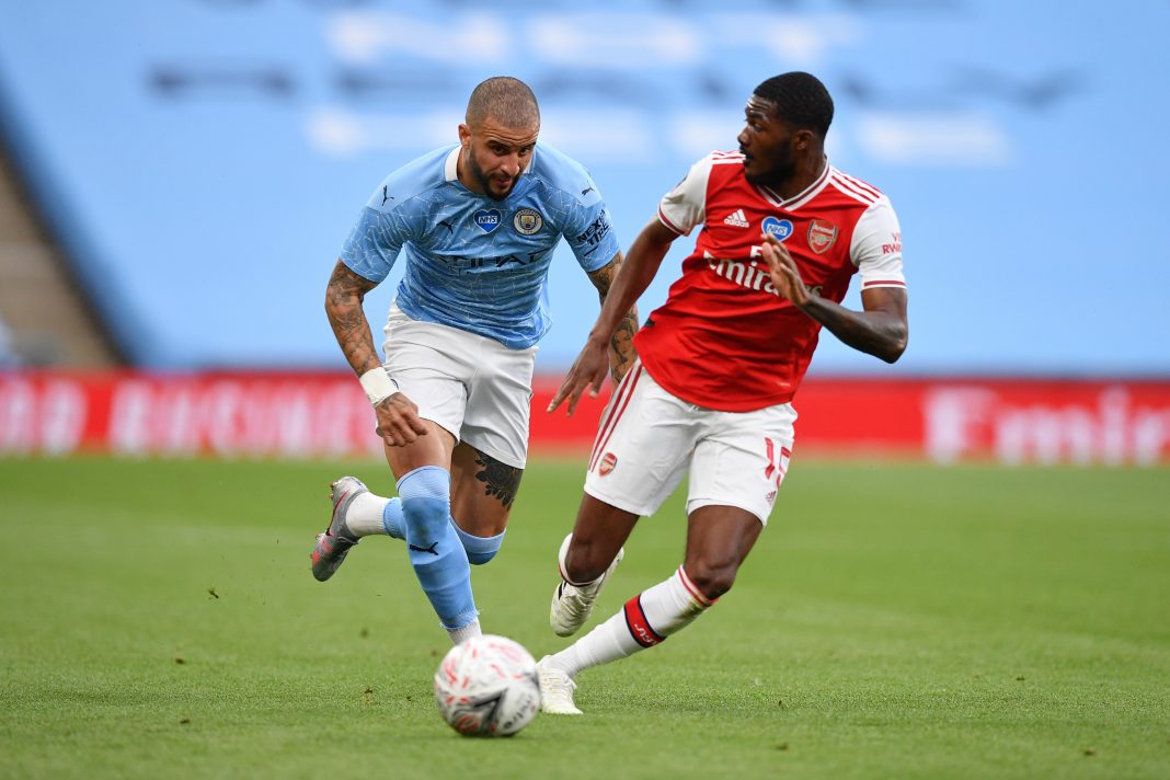 LONDON, ENGLAND - JULY 18: Kyle Walker of Manchester City and Ainsley Maitland-Niles of Arsenal battle for the ball during the FA Cup Semi Final match between Arsenal and Manchester City at Wembley Stadium on July 18, 2020 in London, England. Football Stadiums around Europe remain empty due to the Coronavirus Pandemic as Government social distancing laws prohibit fans inside venues resulting in all fixtures being played behind closed doors. (Photo by Justin Tallis/Pool via Getty Images)